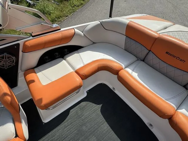 Slide: The Image of 2012 MasterCraft X-35 boat interior with orange and white seating. - 26
