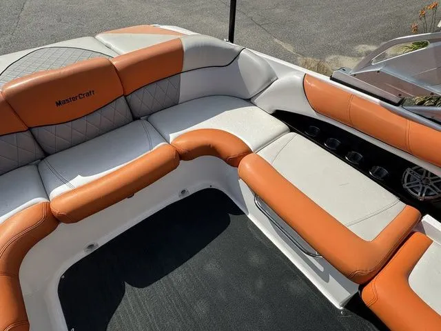 Slide: The Image of 2012 MasterCraft X-35 boat interior with orange and white seating, showcasing luxury design. - 27