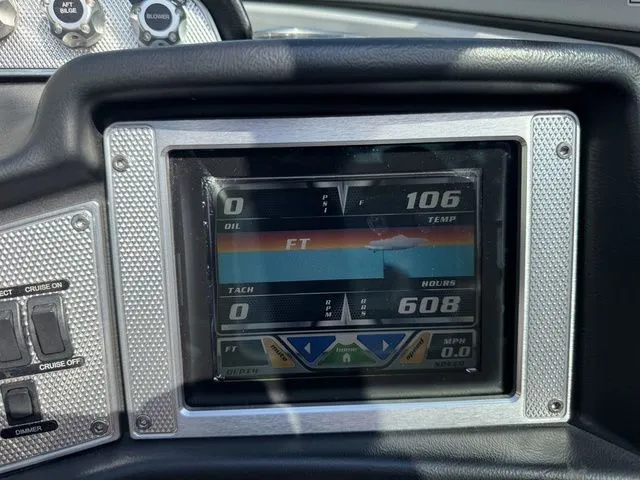 Slide: The Image of Dashboard of a 2012 MasterCraft X-35 boat showing digital gauges and controls. - 39