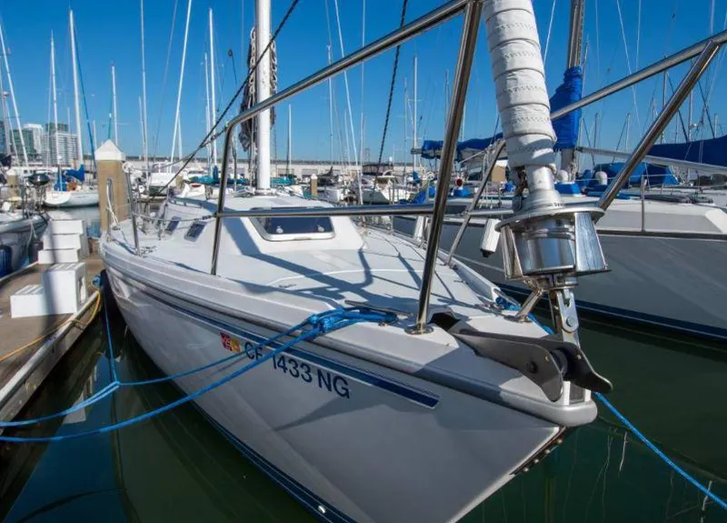 Slide: The Image of 1993 Catalina 34 MK 1.5 sailboat docked in marina, clear blue sky background. - 11