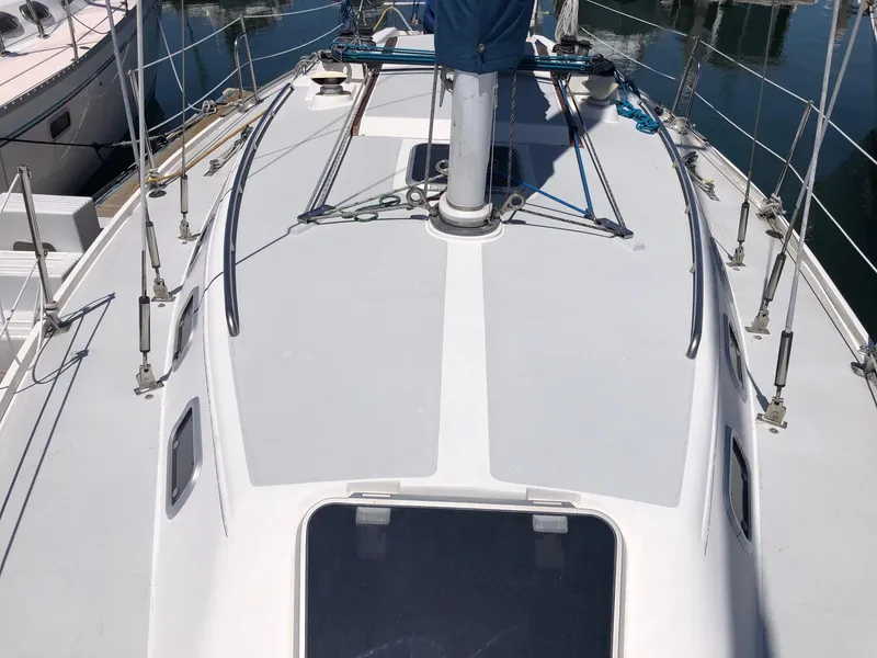 Slide: The Image of Deck view of a 1993 Catalina 34 MK 1.5 sailboat in a marina. - 13