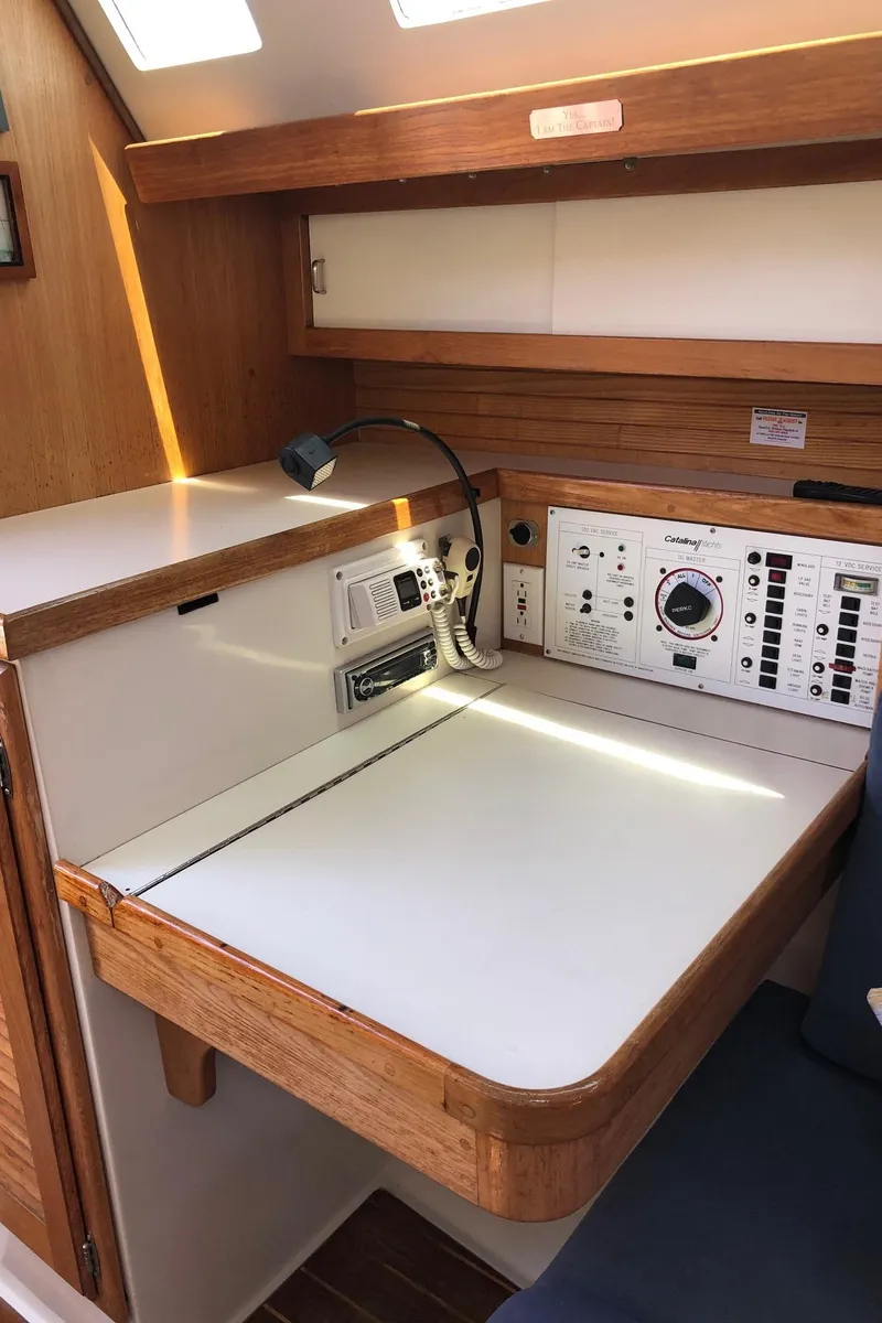 Slide: The Image of Navigation station of 1993 Catalina 34 MK 1.5 sailboat with control panels and radio. - 5