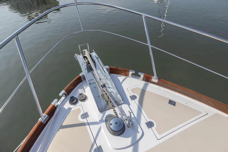 Slide: The Image of Bow of 2005 Grand Banks Eastbay 43 HX yacht with anchor and railing. - 13