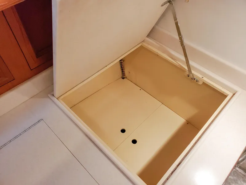 Slide: The Image of Open storage compartment on 2005 Grand Banks Eastbay 43 HX yacht interior. - 26
