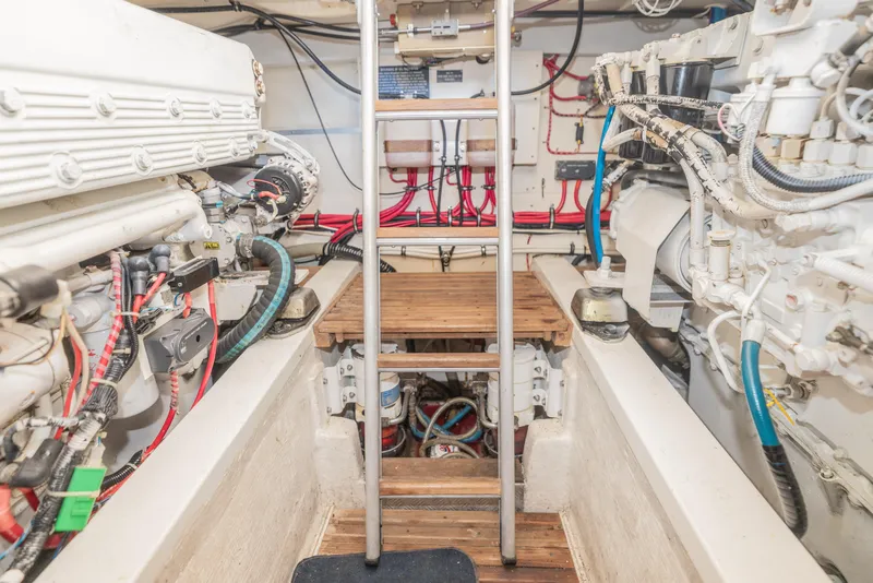 Slide: The Image of Engine room of 2005 Grand Banks Eastbay 43 HX with visible machinery and wiring. - 30