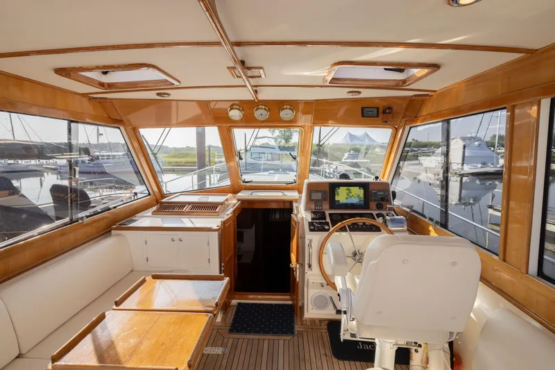 Slide: The Image of Interior of 2005 Grand Banks Eastbay 43 HX yacht with helm and seating area. - 5