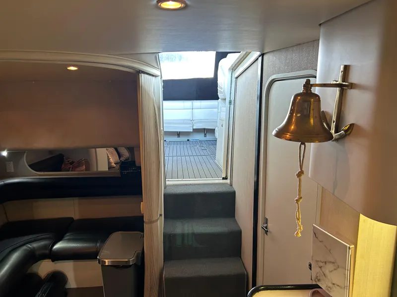 Slide: The Image of Interior of 1997 Cruisers Yachts 3575 Esprit, featuring cozy seating and nautical decor. - 12