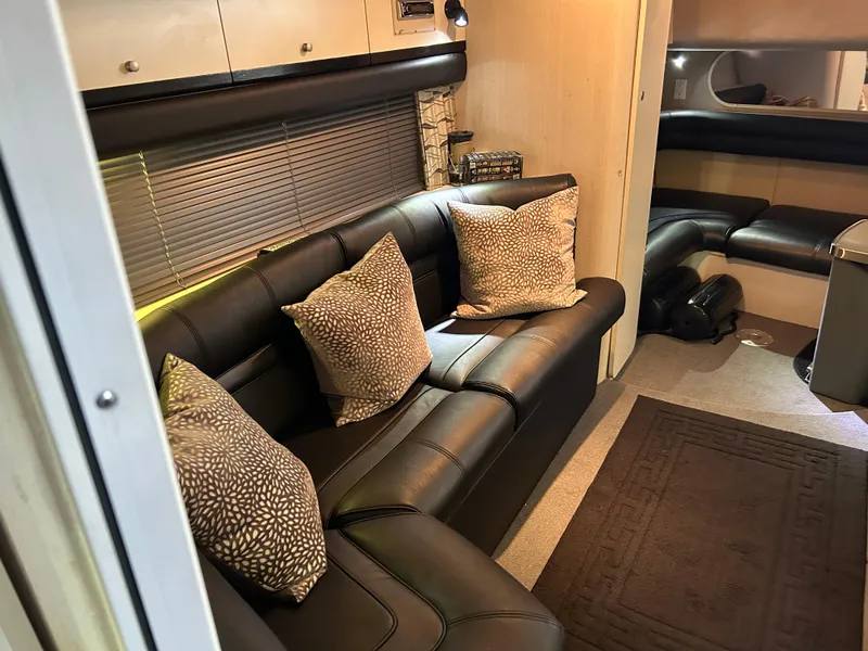 Slide: The Image of Luxurious interior of 1997 Cruisers Yachts 3575 Esprit with leather seating and decorative pillows. - 14