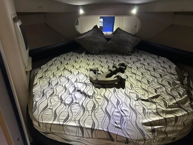Slide: The Image of Cozy cabin interior of 1997 Cruisers Yachts 3575 Esprit with stylish bedding and pillows. - 18
