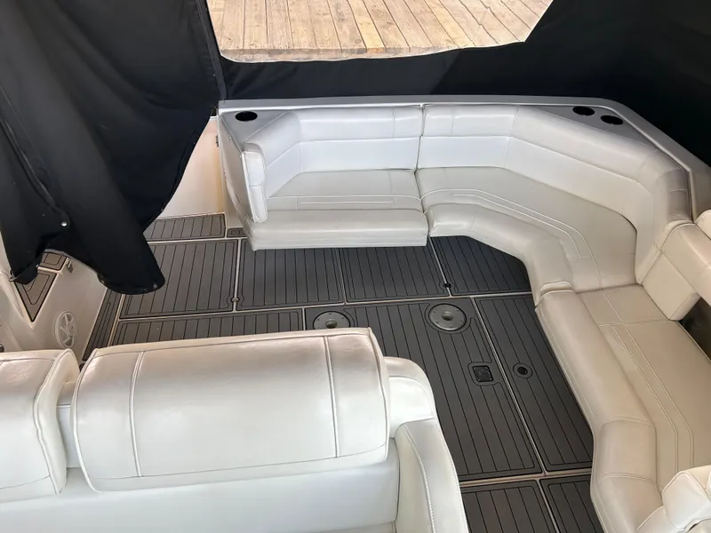 Slide: The Image of 1997 Cruisers Yachts 3575 Esprit interior with white seating and gray flooring. - 22