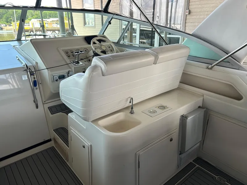 Slide: The Image of 1997 Cruisers Yachts 3575 Esprit cockpit with helm, seating, and sink. - 26
