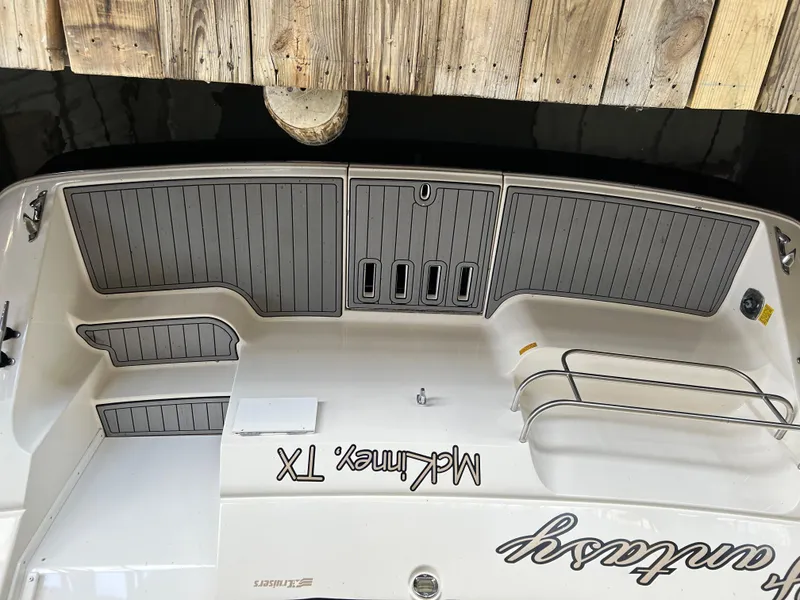 Slide: The Image of 1997 Cruisers Yachts 3575 Esprit boat docked, featuring a sleek deck design. - 29