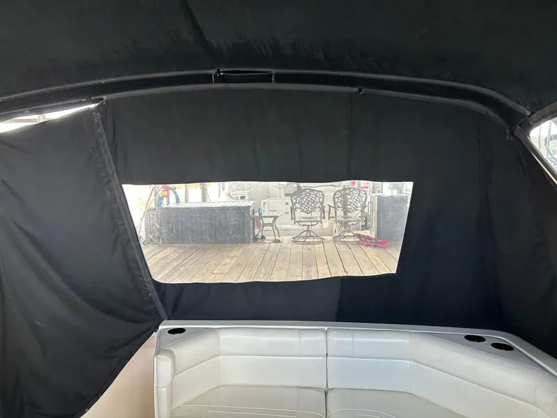 Slide: The Image of Interior view of 1997 Cruisers Yachts 3575 Esprit with black canopy and seating. - 4