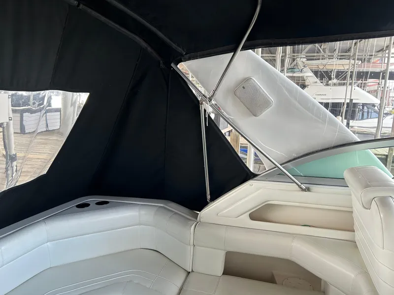 Slide: The Image of Interior view of 1997 Cruisers Yachts 3575 Esprit with white seating and black canopy. - 5