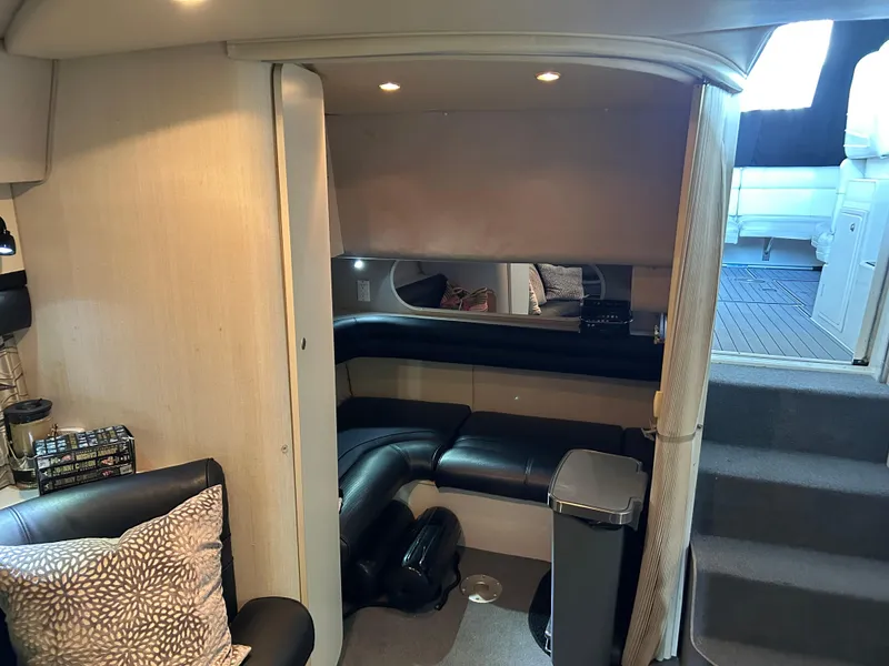 Slide: The Image of Interior of 1997 Cruisers Yachts 3575 Esprit, featuring cozy seating and modern amenities. - 13