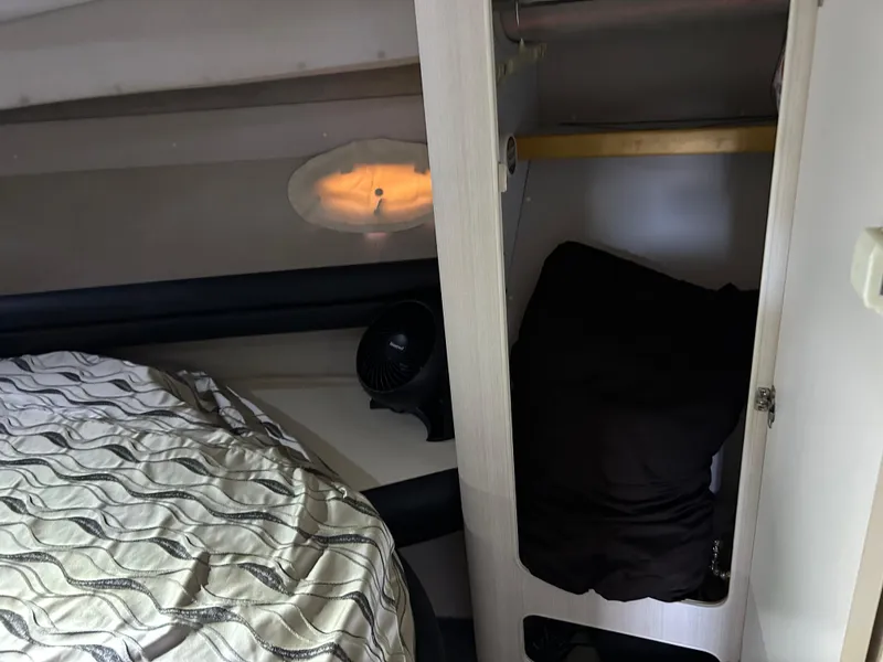 Slide: The Image of 1997 Cruisers Yachts 3575 Esprit cabin interior with bed and closet space. - 17