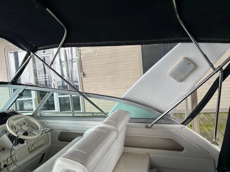 Slide: The Image of Interior view of 1997 Cruisers Yachts 3575 Esprit with steering wheel and seating. - 6