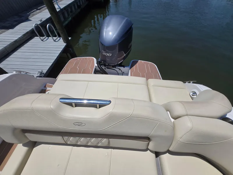Slide: The Image of 2019 Regal 26 OBX boat with Yamaha 300 outboard engine, docked by wooden pier. - 7