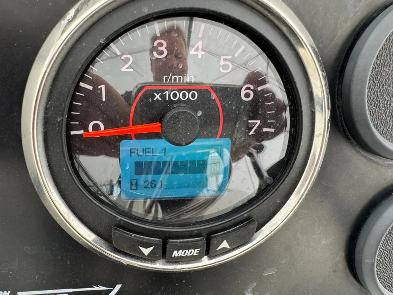 Slide: The Image of Tachometer of 1999 Boston Whaler 21 Outrage showing RPM and fuel level. - 19