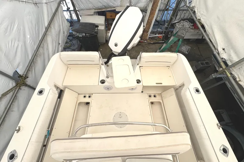 Slide: The Image of 1999 Boston Whaler 21 Outrage boat interior, showing seating and storage areas. - 3