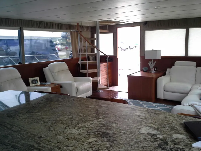 Slide: The Image of Luxurious interior of 2001 Darling Yachts 62 Enclosed Bridge with elegant seating and spiral staircase. - 7