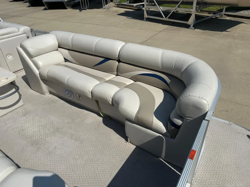 Slide: The Image of 2006 Crest Caribbean 250 boat interior with plush seating and modern design. - 4