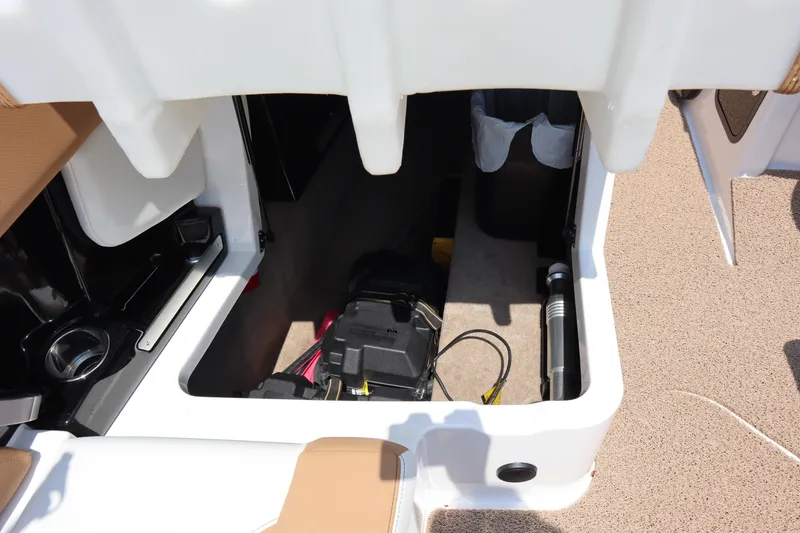 Slide: The Image of 2020 MasterCraft X24 storage compartment with battery and equipment. - 10