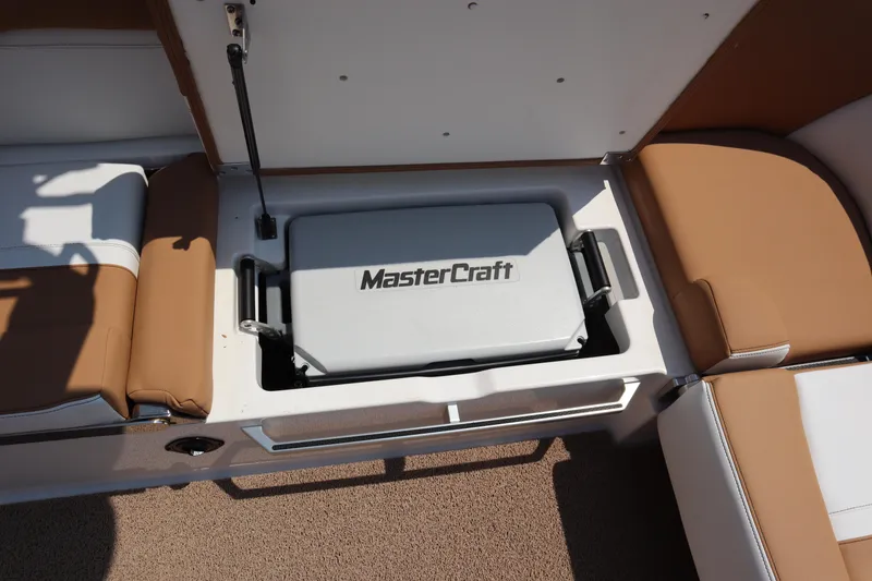 Slide: The Image of 2020 MasterCraft X24 boat storage compartment with integrated cooler. - 15