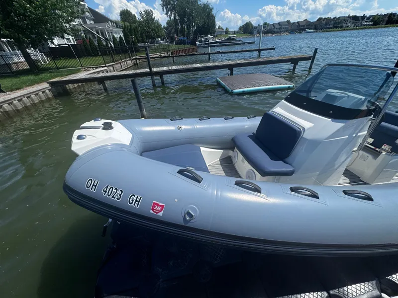 Slide: The Image of 2022 Brig Eagle 6 inflatable boat docked on a sunny lake. - 5