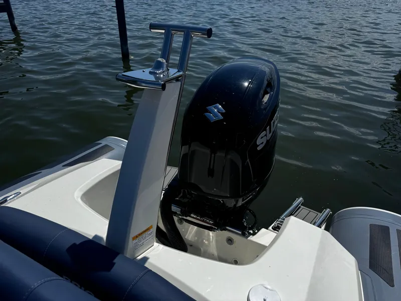 Slide: The Image of 2022 Brig Eagle 6 boat with Suzuki outboard motor on water. - 27