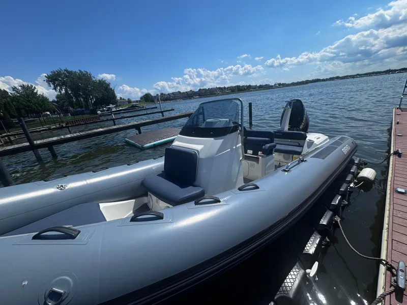 Slide: The Image of 2022 Brig Eagle 6 boat docked on a sunny day by the lake. - 6