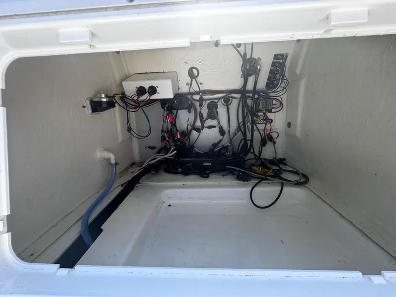 Slide: The Image of Electrical compartment of 2022 Brig Eagle 6 boat, showcasing wiring and components. - 13