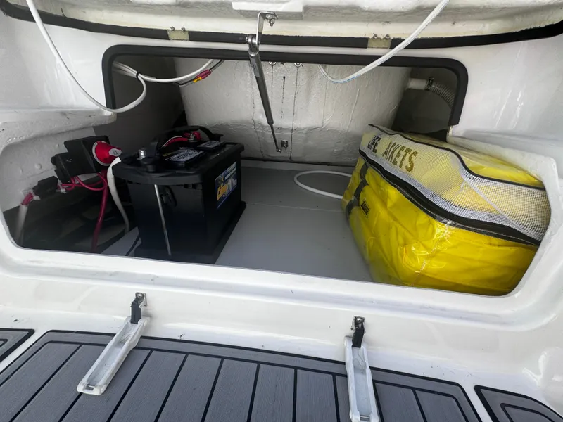 Slide: The Image of 2022 Brig Eagle 6 storage compartment with battery and life jackets. - 20