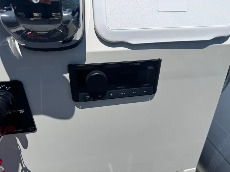 Slide: The Image of Control panel of 2022 Brig Eagle 6 boat with Fusion audio system. - 25