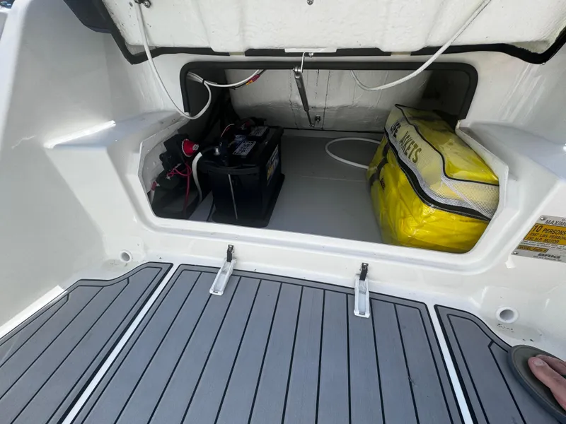 Slide: The Image of 2022 Brig Eagle 6 storage compartment with battery and life jackets. - 18