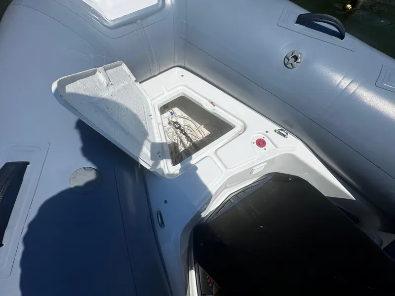 Slide: The Image of 2022 Brig Eagle 6 boat interior with open storage compartment. - 11