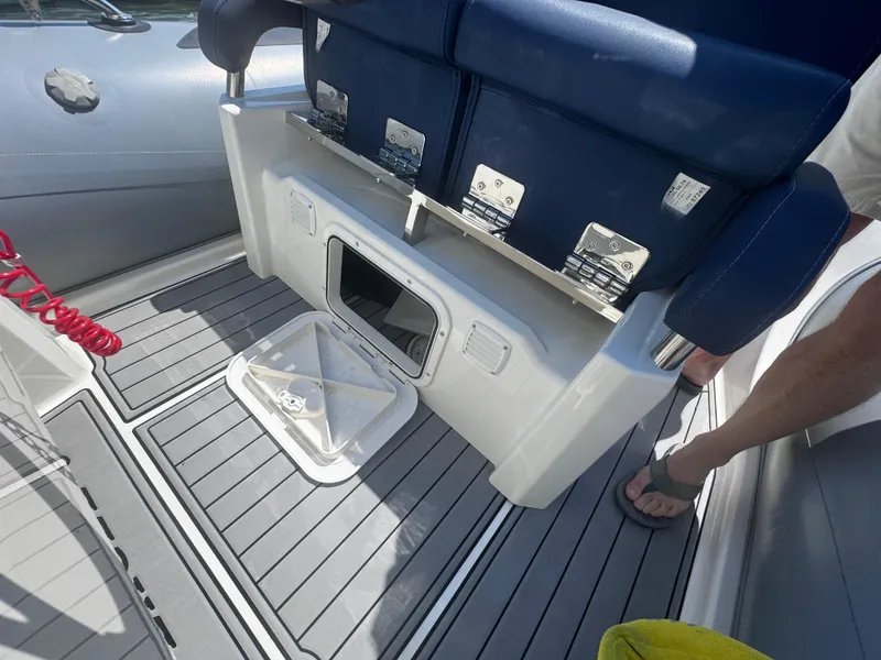 Slide: The Image of 2022 Brig Eagle 6 boat interior with storage compartment and seating. - 17