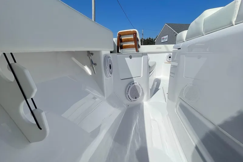 Slide: The Image of Interior of 2023 Jupiter 40 boat with white seating and built-in speakers. - 13