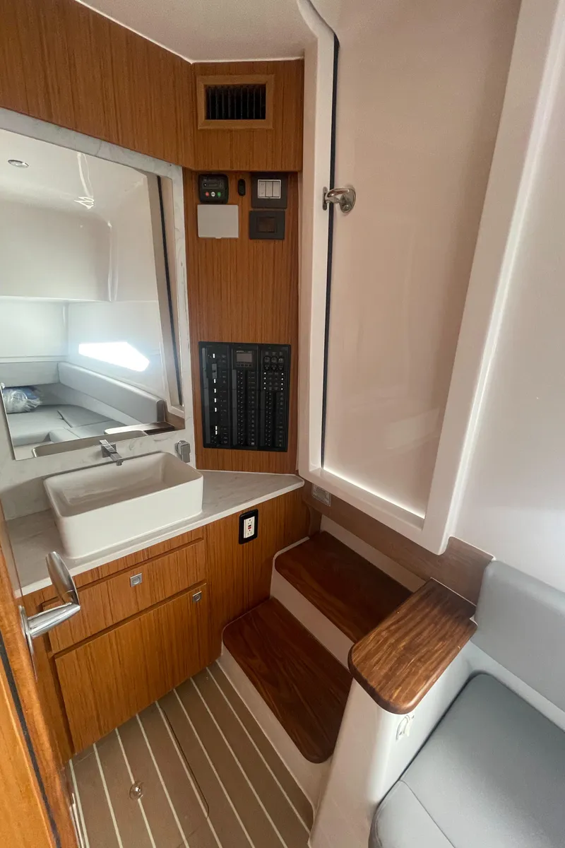 Slide: The Image of 2023 Jupiter 40 boat interior with wooden cabinetry and modern fixtures. - 22