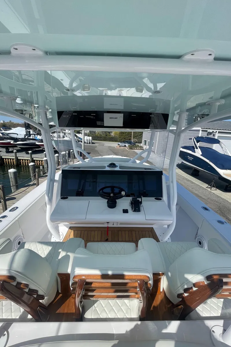 Slide: The Image of 2023 Jupiter 40 boat cockpit with modern controls and seating. - 8