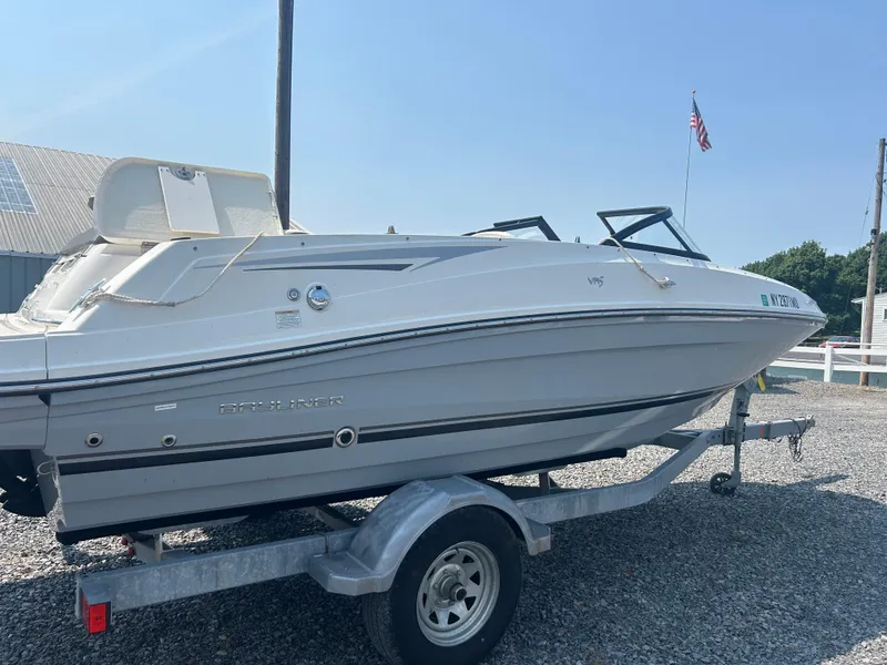 Slide: The Image of 2017 Bayliner VR5 Bowrider I/O on trailer, parked outdoors, clear sky background. - 3