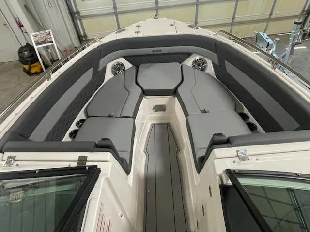 Slide: The Image of 2025 Chaparral 26 Surf boat interior with gray seating and modern design. - 6