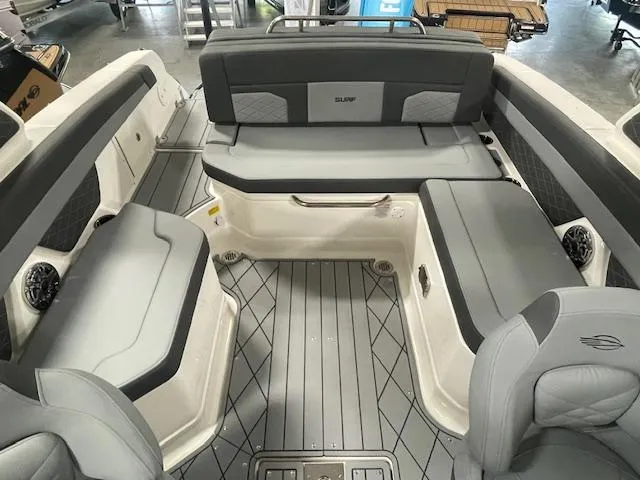 Slide: The Image of 2025 Chaparral 26 Surf boat interior with gray seating and modern design. - 7