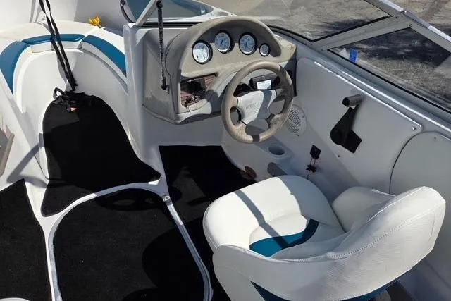Slide: The Image of Interior of 2001 Four Winns 180 Horizon boat with steering wheel and gauges. - 5