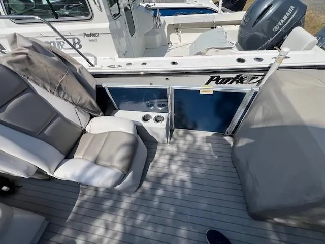 Slide: The Image of 2016 Godfrey 242 Premiere boat interior with seating and Yamaha engine. - 5