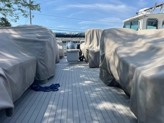 Slide: The Image of Covered seating area on a 2016 Godfrey 242 Premiere boat deck. - 8