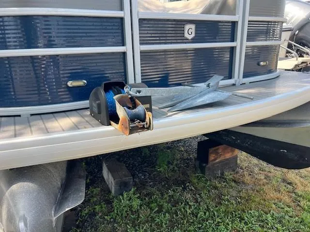 Slide: The Image of 2016 Godfrey 242 Premiere boat with anchor and winch on deck. - 9