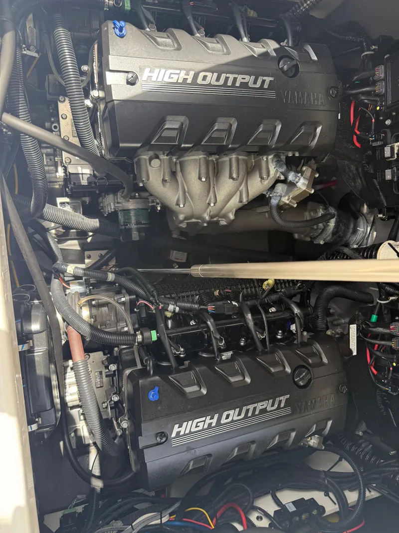 Slide: The Image of 2023 Yamaha Boats 222 FSH Sport high output engine compartment, showcasing dual engines. - 7