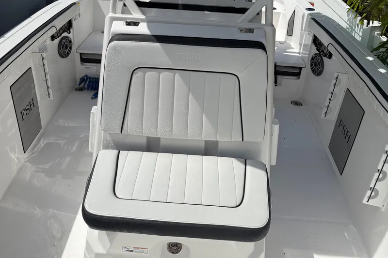 Slide: The Image of 2023 Yamaha Boats 222 FSH Sport interior with cushioned seating and sleek design. - 9