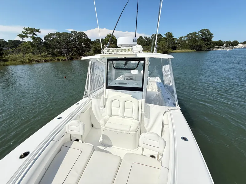 Slide: The Image of 2018 Sea Hunt Gamefish 30 boat with forward seating on calm water. - 11